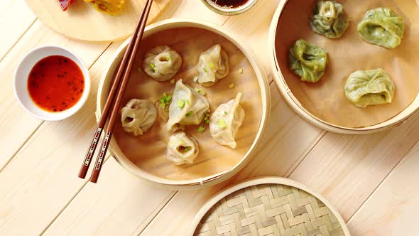 Traditional Chinese Dumplings Served in the Wooden Bamboo Steamer