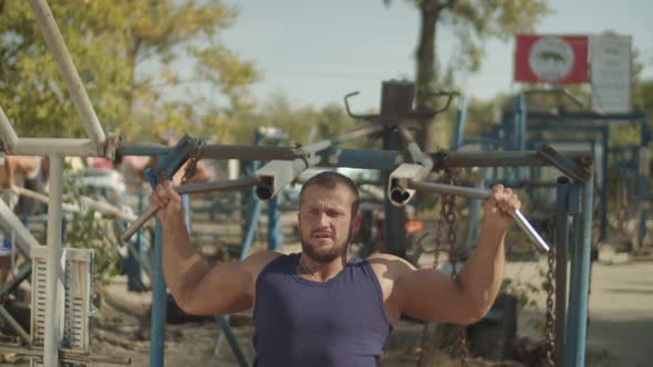 Bodybuilder Training Using Shoulder Press Machine