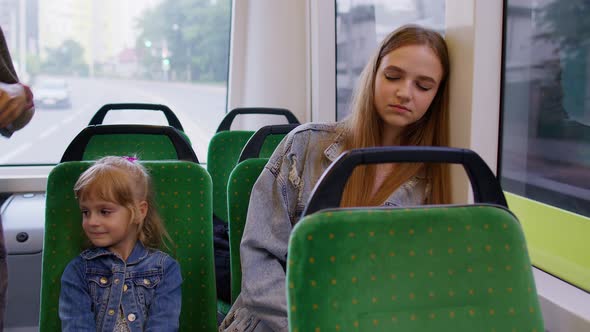 Exhausted Mother Fall Asleep and Missed Stop Station in Tram Kid Daughter Wakes Tired Sleepy Woman