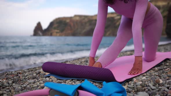 Young Woman with Black Hair Fitness Instructor in Leggings and Tops Doing Stretching and Pilates on