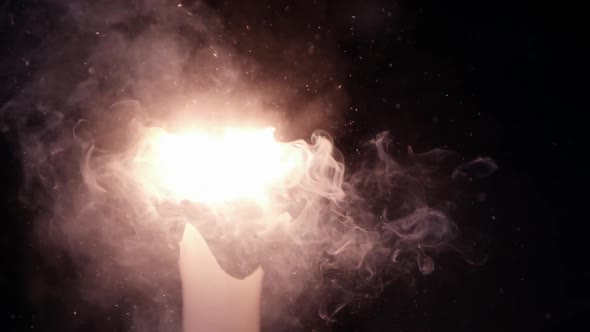 Slow motion of hammer shattering light bulb as it burns out alt