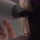 A Young Woman Dries Her Hair with an Electric Hair Dryer - VideoHive Item for Sale