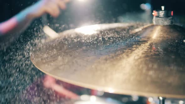 A Drummer Hits Cymbal with Water on It. Drrummer, Drumset, Drums Slow Motion