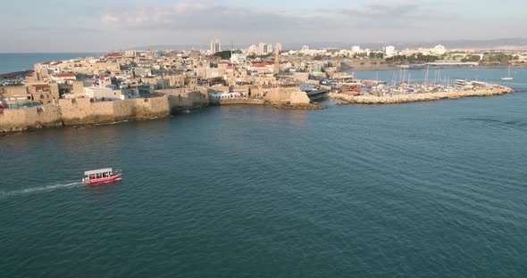 Aerial view of natural water pool along the coast in Acre Old town, Israel.