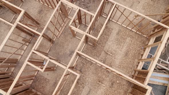 Aerial of a house in mid construction, still needs a roof.