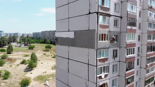 Industrial Climber Painting Building Facade Wall, Insulation Work, Aerial View