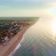 Flying over the coast and seaside village at sunset in the evening. 4K 30fps - VideoHive Item for Sale