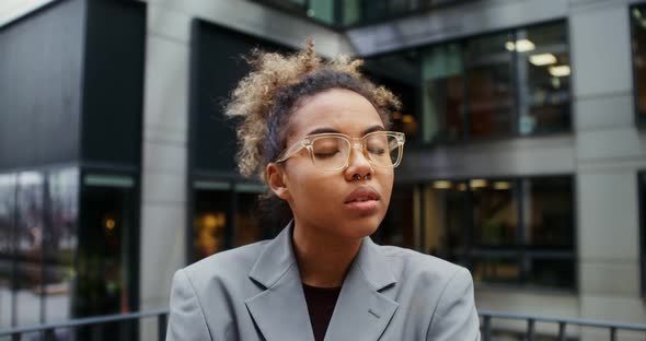 AfricanAmerican Businesswoman Turns Her Head and Looks at the Camera