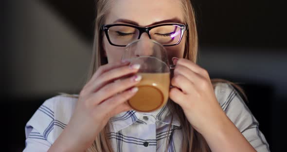 Female Entrepreneur Enjoying Coffee In Office