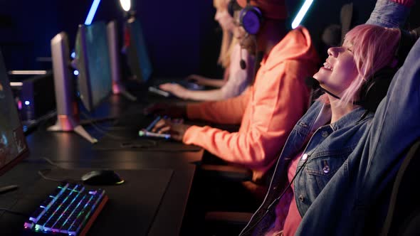 Team of Professional eSport Gamers Playing in Competitive Video Games on a Cyber Games Tournament