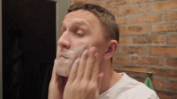 Man Puts Shaving Gel His Face