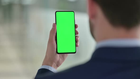 Businessman Using Smartphone with Chroma Screen