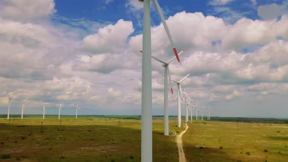 Aerial Drone Shot Windmills For Electric Power. Energy Production with clean and Renewable Energy