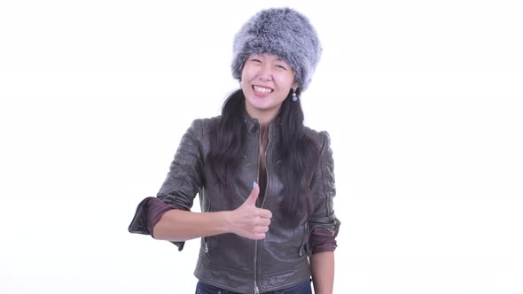 Happy Beautiful Asian Woman Giving Thumbs Up