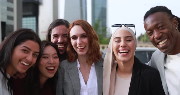 Multiracial business people smiling on camera outdoor