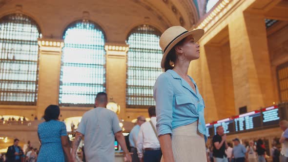 Young tourist receiving message at the Grand Central Terminal