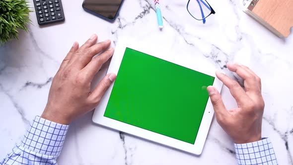 Top View of Businessman Using Digital Tablet on Office Desk