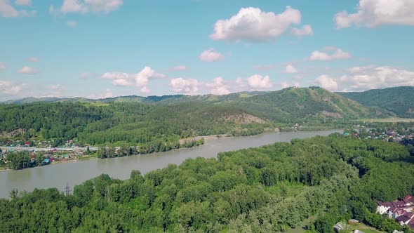 Aerial Shot: Top View of Mountains, Pine and Deciduous Forest, Mountain River