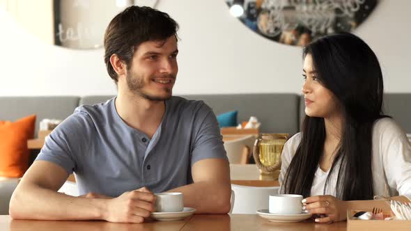 Two Friends Chat at the Cafe