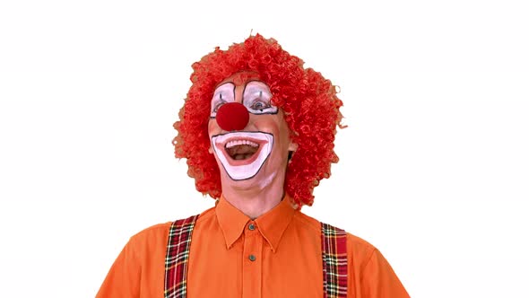 Happy Walking Clown Looking To the Sides on White Background