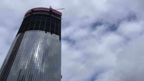 Modern Skyscraper Under Construction with Crane