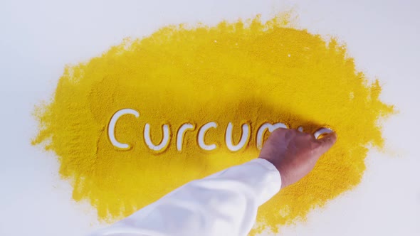 Hand Writes On Turmeric Curcumin