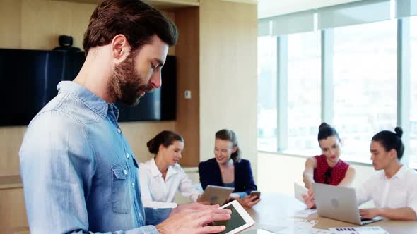 Male business executive using digital tablet