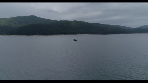 Old Boat Moves on the Lake - Cinematic Drone