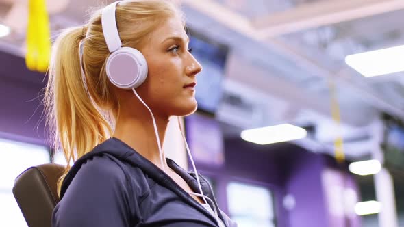 Fit woman exercising on a machine