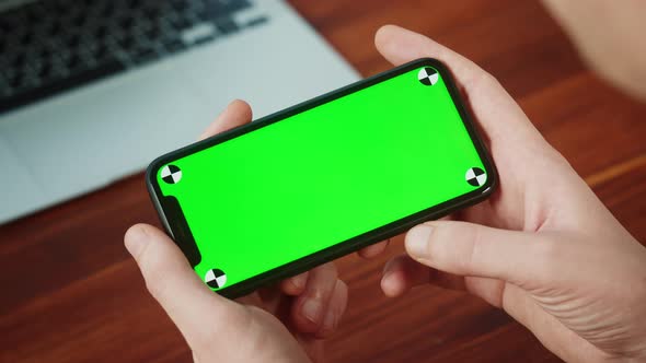 Man Using Smartphone with Chroma Key Closeup