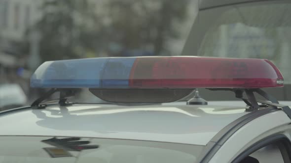 Flashing Flasher on the Roof of a Police Car. Blinker. Close-up.