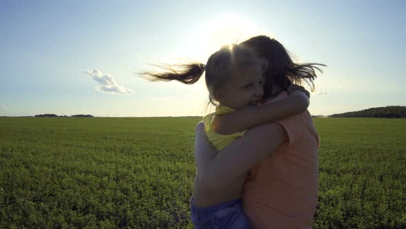 Children Playing In The Summer Field With Grass And Blue Sky alt