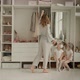 Mom Tries on a Dress and Twin Daughters Admire Her - VideoHive Item for Sale