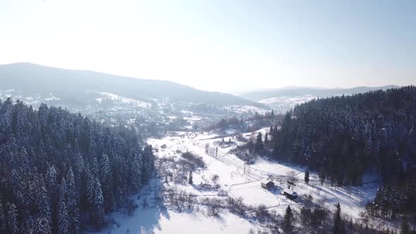 Village with the Buildings Is All Covered with Snow. Aerial View