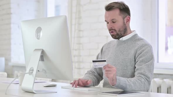 Man Reacting To Online Payment Failure at Work