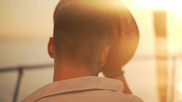 in Slow Motion Man in White Jacket Putting on Nice Straw Hat Backside on Sunrise