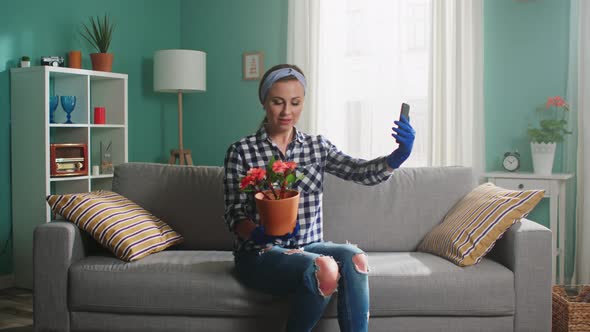 Woman Grower Is Recording Video On Gadget