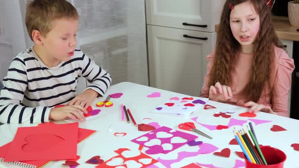 Kids Children Doing Valentine's Day Arts and Crafts with Hearts Pencils Paper