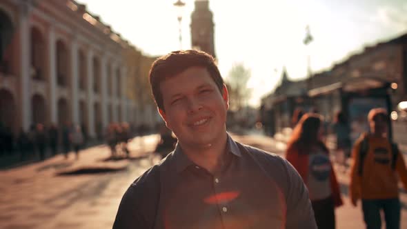 Portrait of Attractive Smiling Male Outdoors in Urban Environment.