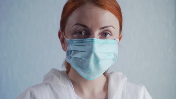 Portrait of a Nurse in a Facial Mask.