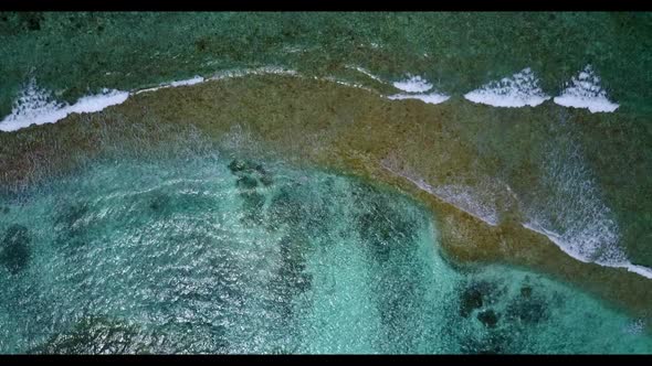 Aerial above travel of marine resort beach vacation by blue ocean and white sandy background of a da