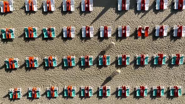 Empty sun loungers on the beach aerial view 4 K Turkey Alanya