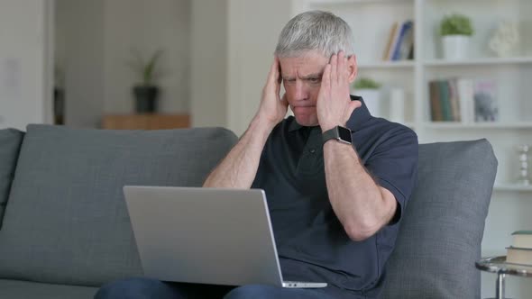 Hardworking Middle Aged Businessman Having Headache on Sofa