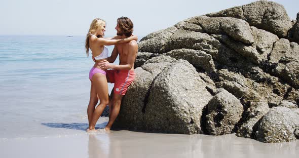 Romantic couple standing at beach