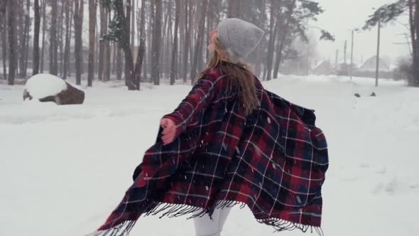 Dancing Woman Traveling Among Forest Wearing Hat and Poncho Boho and Wanderlust Style