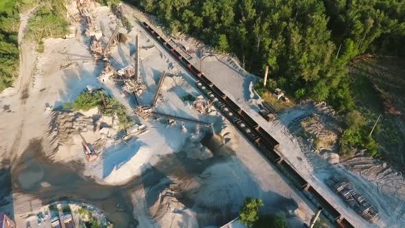 Railroad and heavy machinery on mining quarry