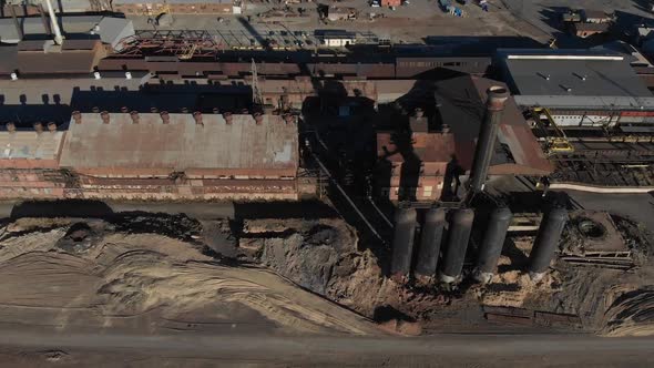 Overhead aerial of antique steel processing facility.  Industrial, rusty, with all the sooty goodnes