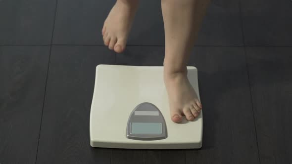 Woman Measuring Body Weight on Scales, Healthy Dieting, Healthy Person, Frontal