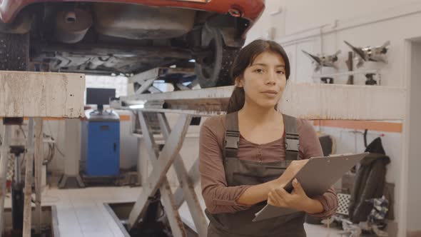 Portrait of Woman at Work in Auto Repair Shop