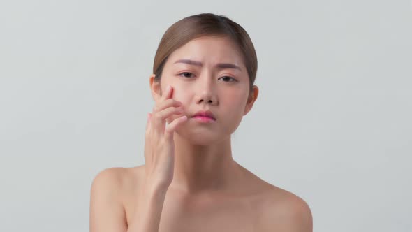 facial beauty skin concept asian female attractive closeup hand touch softy face checking disease